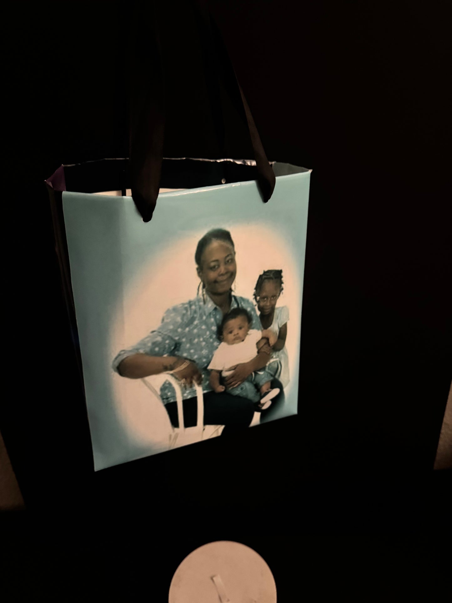 Custom gift bags featuring personalized photos and text for celebrations
